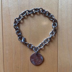 Tiffany silver bracelet with “Tiffany & Co New York” round charm
